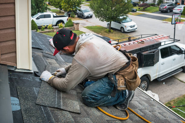 Professional Roofing technician working in Washington Mills, NY